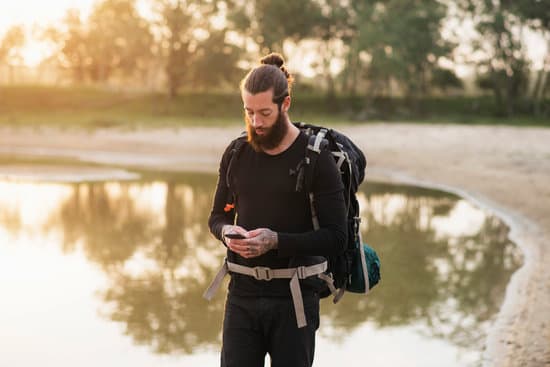 Hiker using cellphone during trip